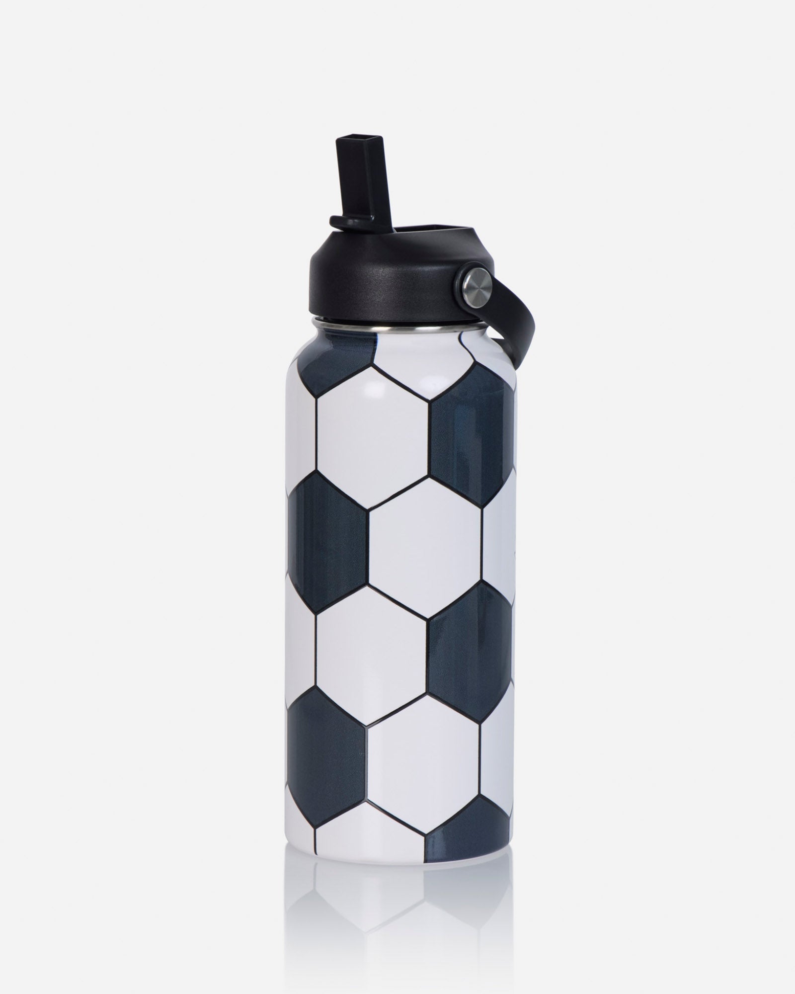 A stainless steel water bottle with a black and white soccer ball pattern, featuring a black flip-top lid with a carrying loop, set against a light gray background with a soft reflection.
