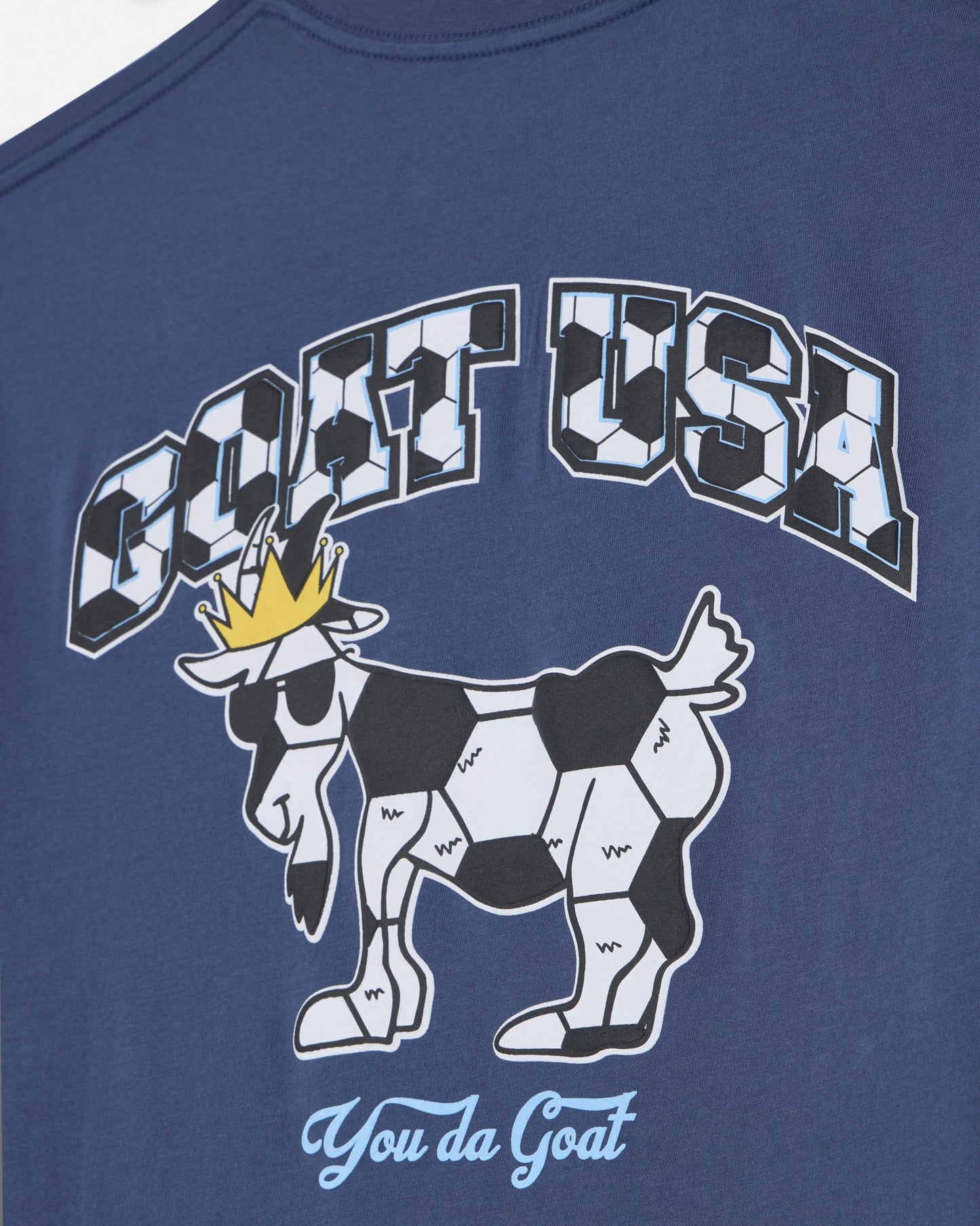 Navy blue t-shirt with a graphic of a goat wearing a crown and 'GOAT USA' text on a white background.