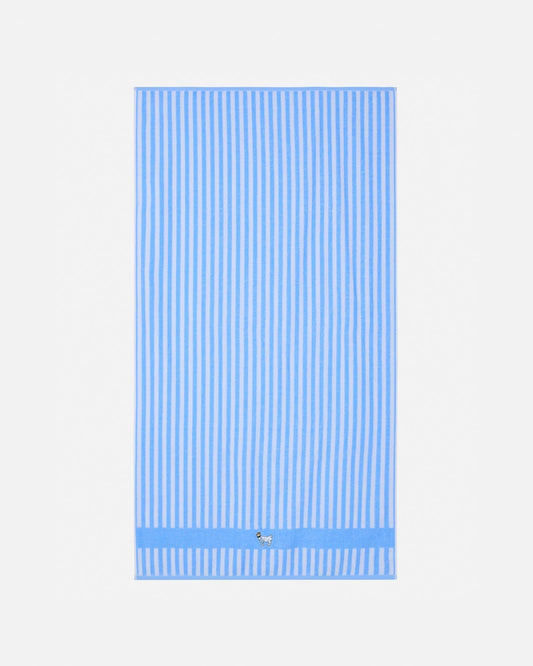 Blue and white striped towel on a light gray background