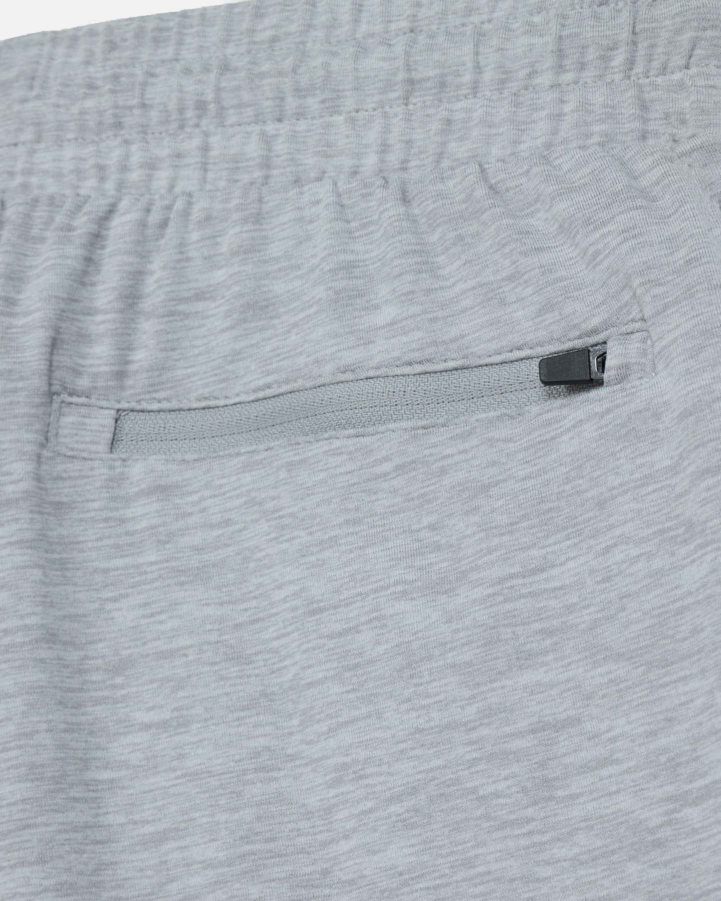 Close-up of gray shorts with a zipper pocket#color_space-dye-gray