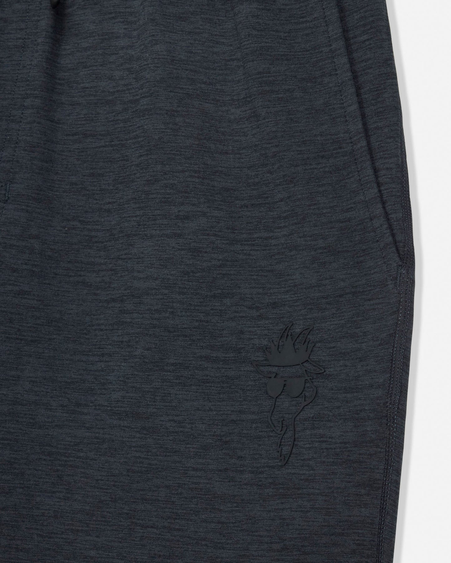 Dark gray sweatpants with a small embroidered design on a white background#color_space-dye-black