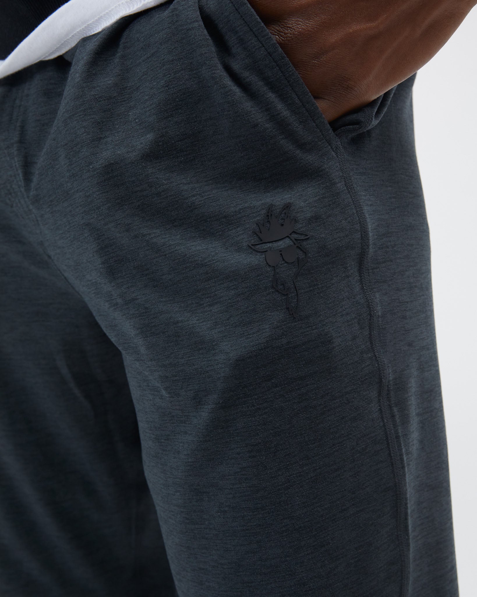 Dark gray sweatpants with a logo on a white background#space-dye-black