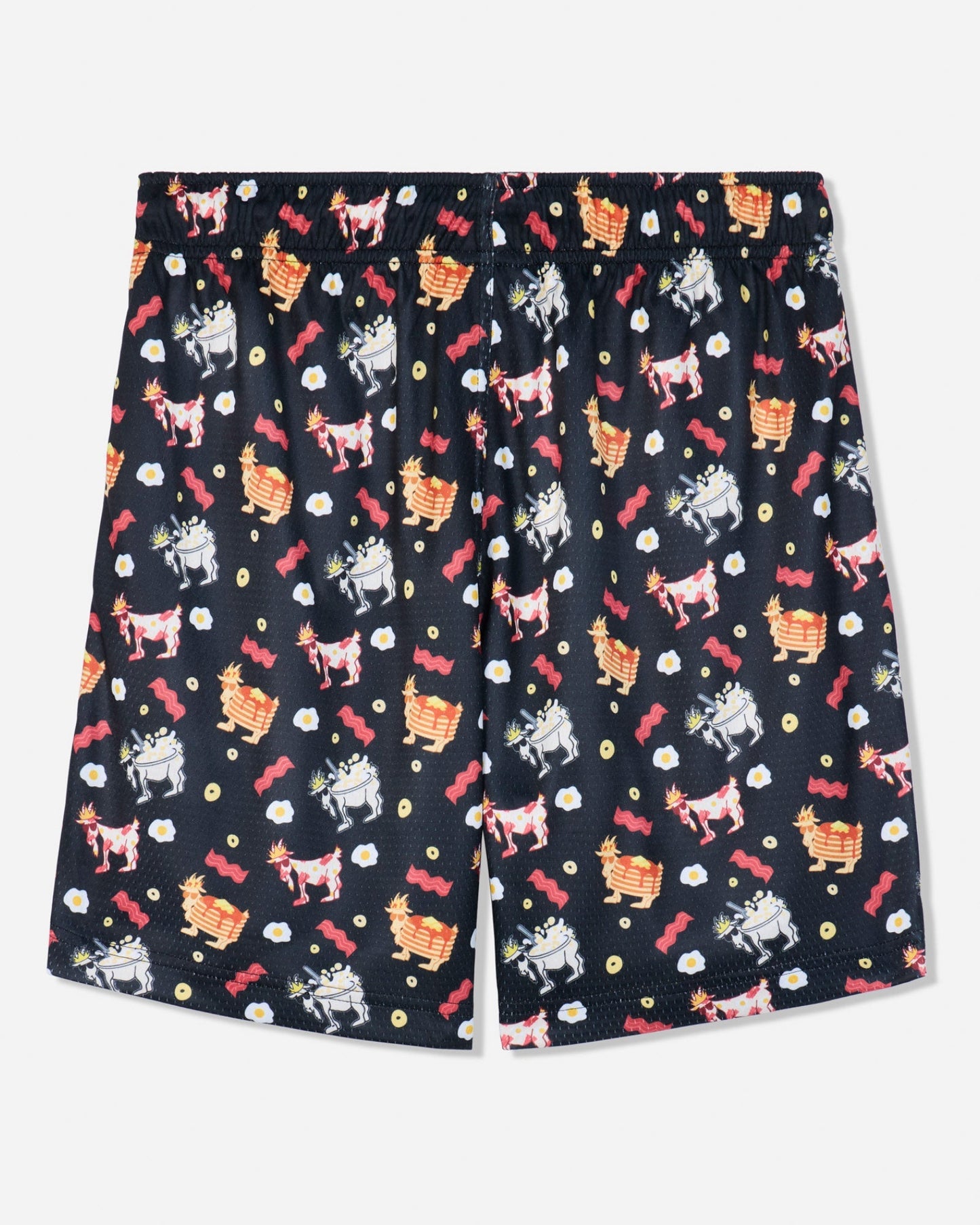 A pair of black shorts featuring an all-over whimsical pattern of cartoon goats, red roses, and small white flowers, displayed flat against a light gray background.