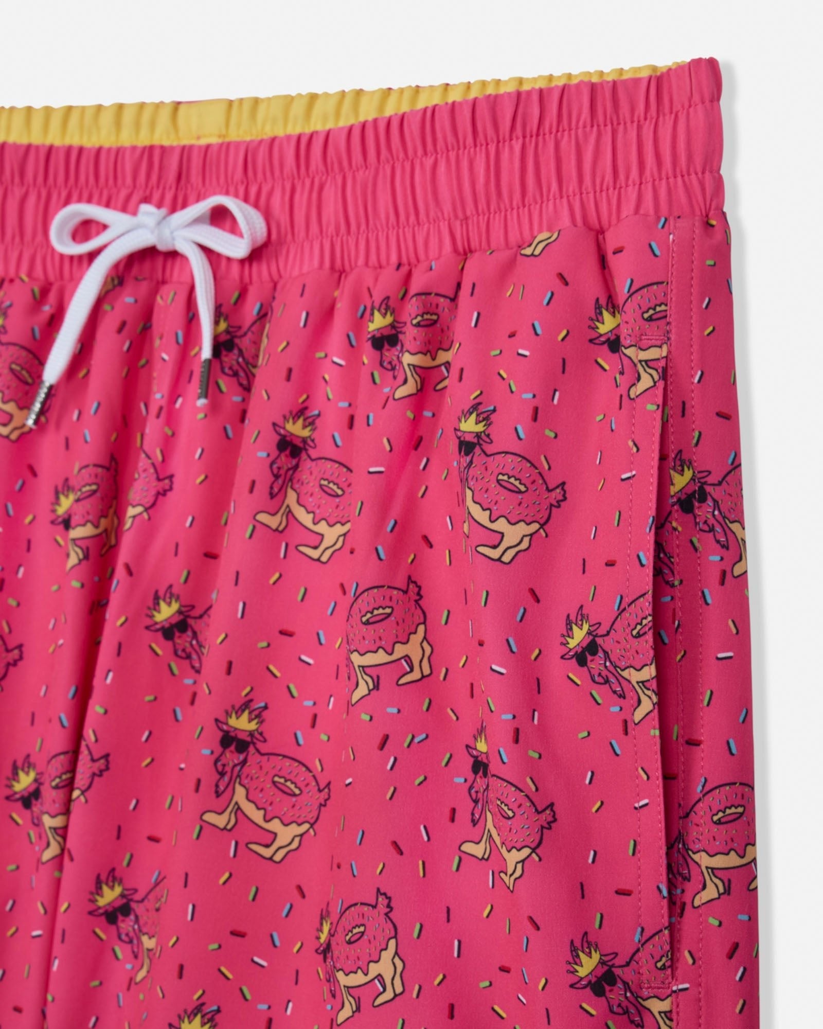 Pink shorts with cartoon character pattern on a white background