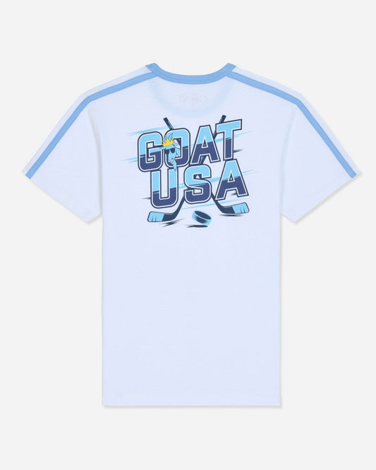 A white short-sleeve t-shirt with light blue shoulder stripes and a large 'GOAT USA' graphic printed on the chest in blue, navy, and yellow, set against a light gray background.