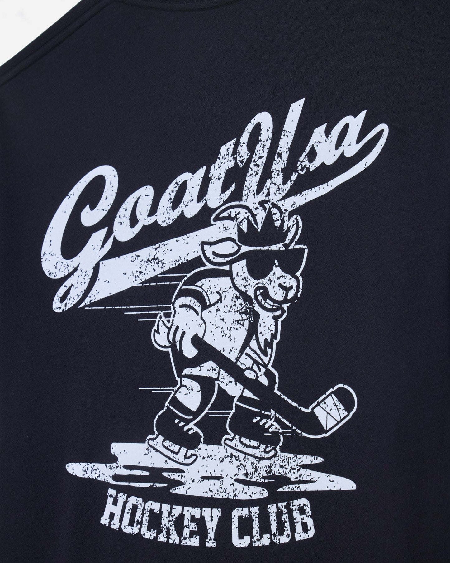 Close-up of black t-shirt with goat hockey player graphic