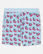 Swim shorts with goat and flamingo pool float pattern on a light blue background