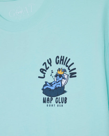 Mint t-shirt with goat laying in bed left-chest graphic