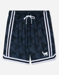 Black athletic shorts with a subtle geometric pattern, featuring white side stripes, a white drawstring, and a small white goat logo with a yellow flower on the lower left leg.#color_black