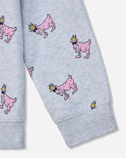 Close-up of a light heather gray fabric garment with an allover print of pink cartoon goats wearing small yellow crowns, shown on a sleeve with ribbed cuffs.#color_pale-gray-heather