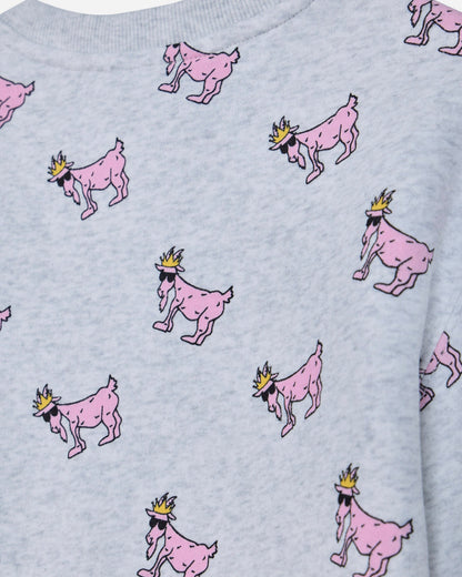 Close-up of a light gray heather sweatshirt featuring an all-over print of pink cartoon goats wearing small gold crowns.#color_pale-gray-heather