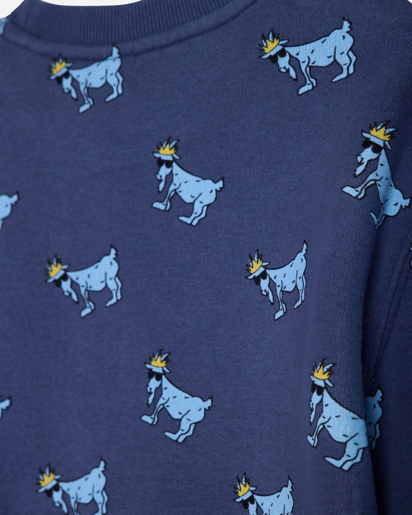 Close-up of navy crewneck with blue goats#color_navy