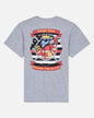 A heather gray short-sleeve t-shirt shown from the back, featuring a large graphic print of a cartoon goat wearing a crown and sunglasses, with red banners reading 'GOAT USA' and 'SUPPORT THE BRAVE'.