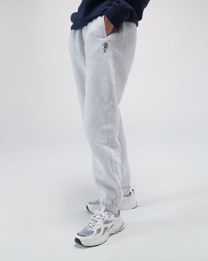 Person wearing sweatpants with a small logo#color_pale-gray