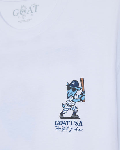 White short-sleeve t-shirt featuring a blue cartoon goat baseball player holding a bat, with 'GOAT USA New York Yankees' printed below.#color_white