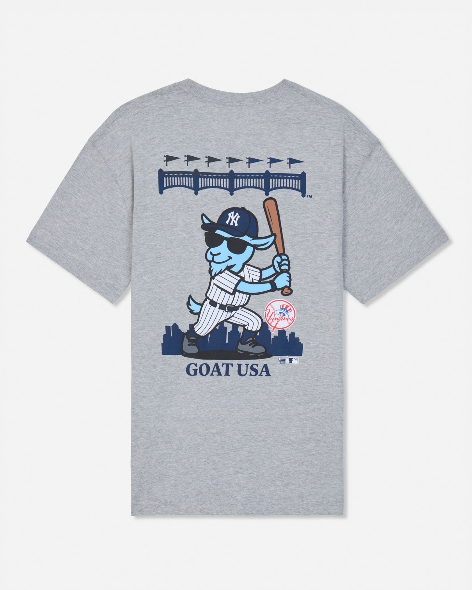 A heather gray short-sleeve t-shirt with a large graphic on the front featuring a cartoon blue goat in a New York Yankees uniform holding a bat, with 'GOAT USA' printed below.#color_gray